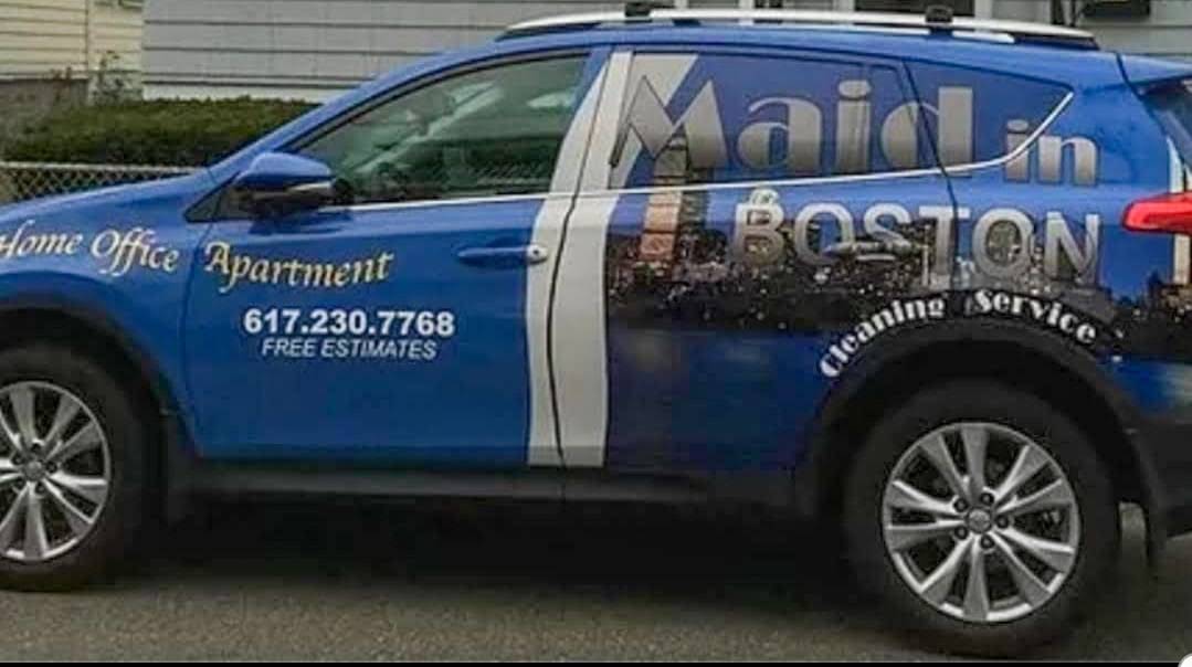Side view of Maid In Boston's real wrapped cleaning service vehicle